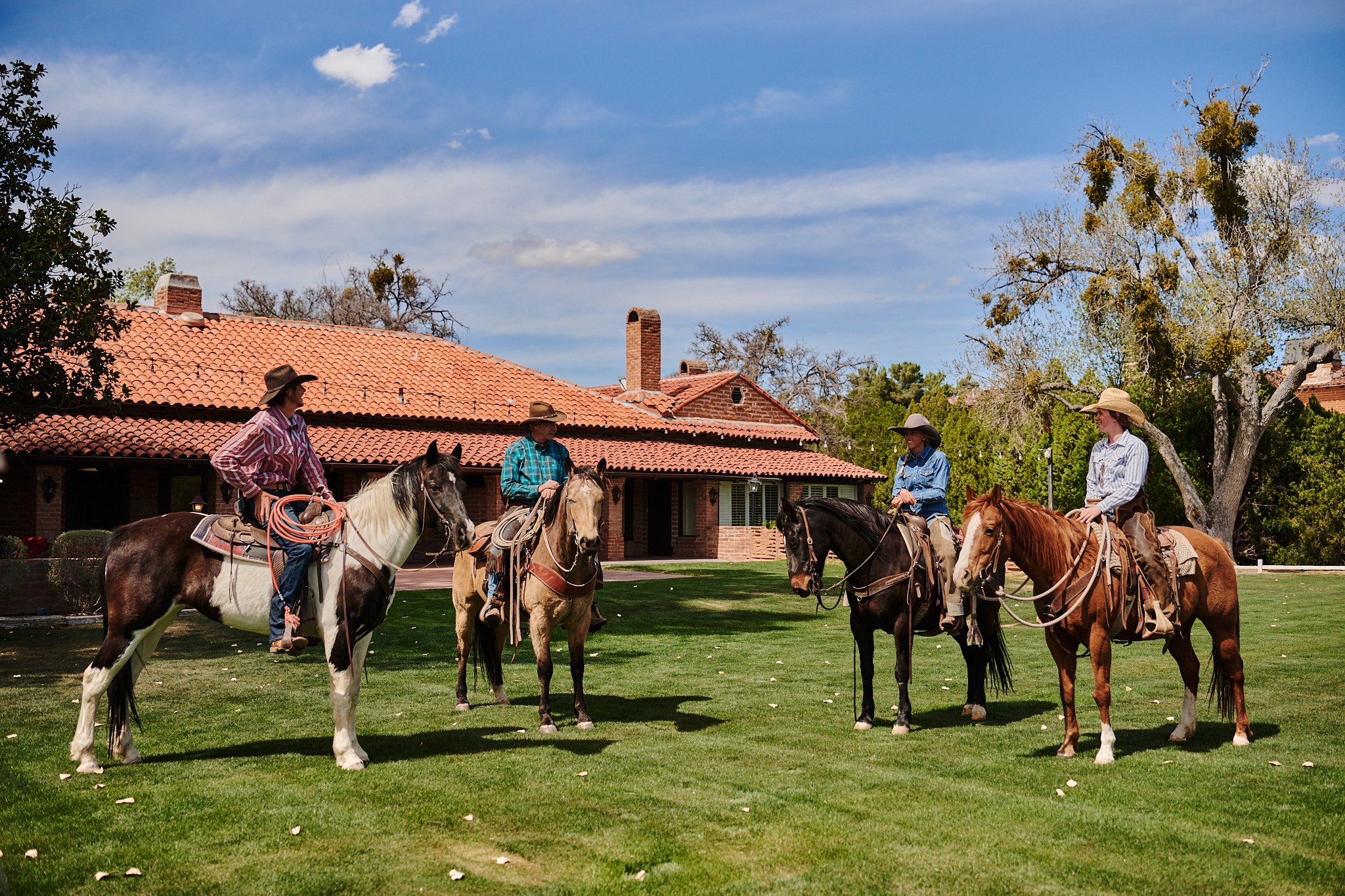 A group of horseback riders gather at the historic Otero Ranch at Tubac Golf Resort.