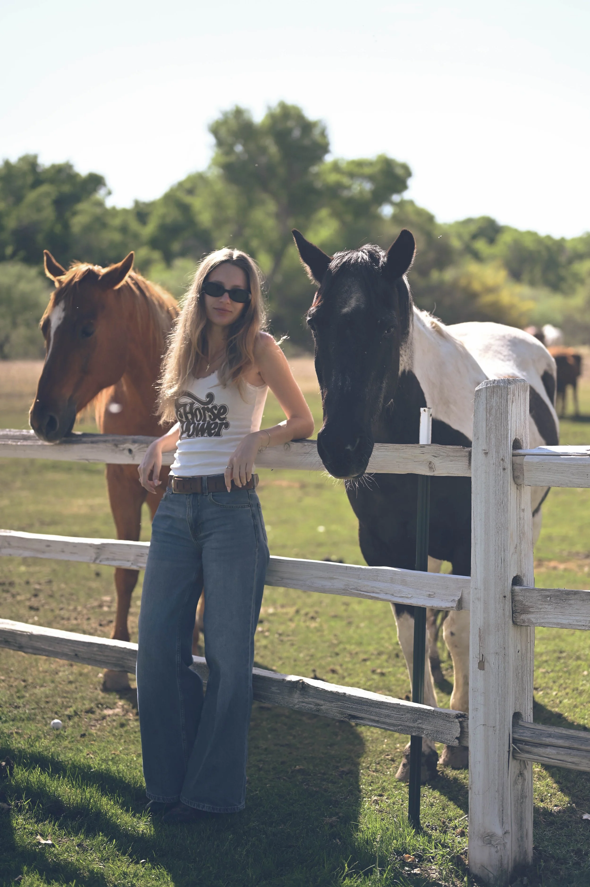 A dude ranch guest poses with horses at Otero Ranch at Tubac Golf Resort. 