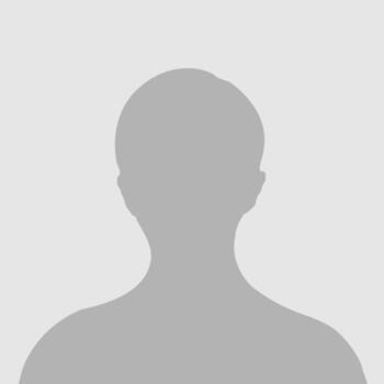 Silhouette of a person's head and shoulders on a gray background.