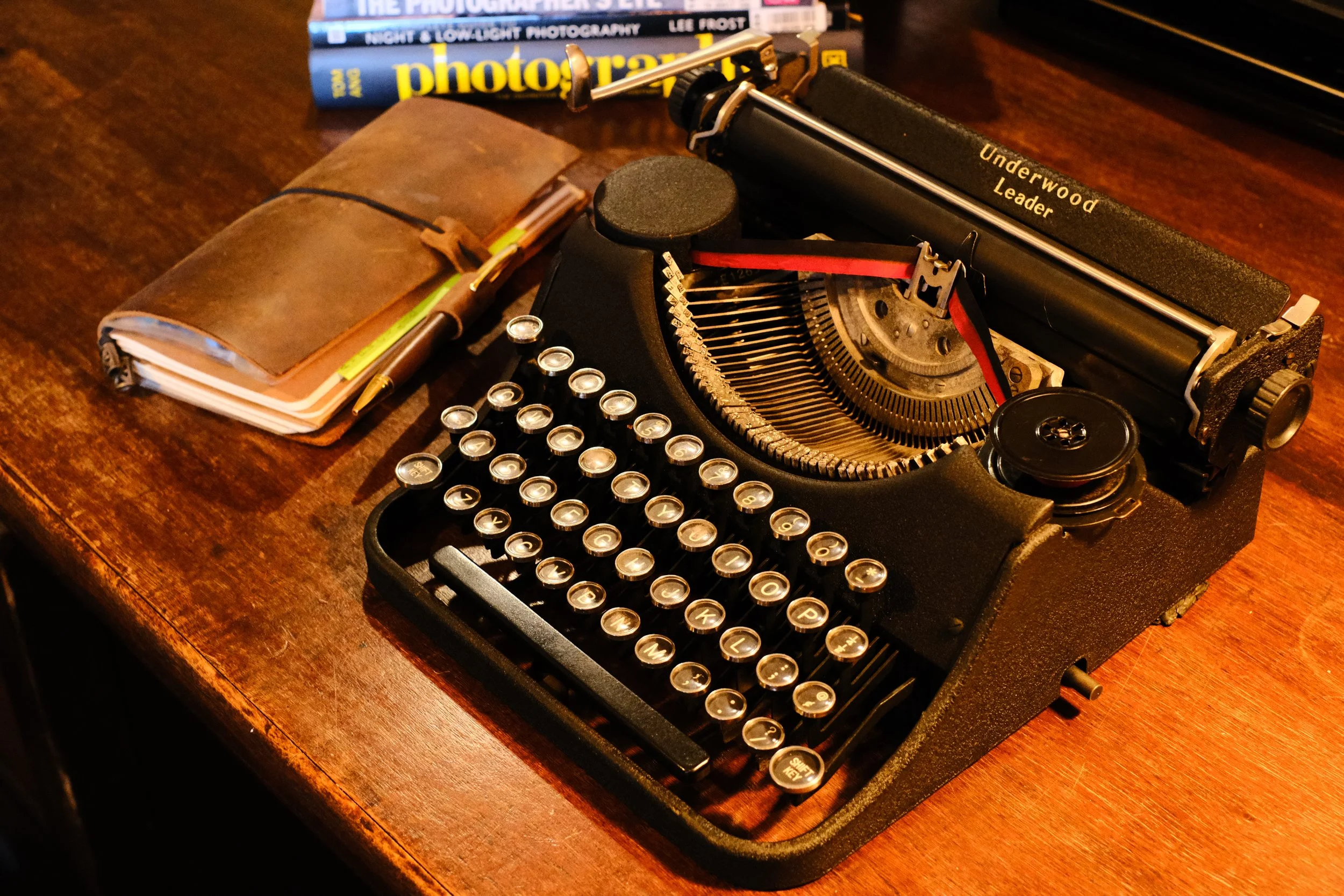 1938 Underwood Leader black with glass keys and a missing ribbon cover making it look like it wears a monocle
