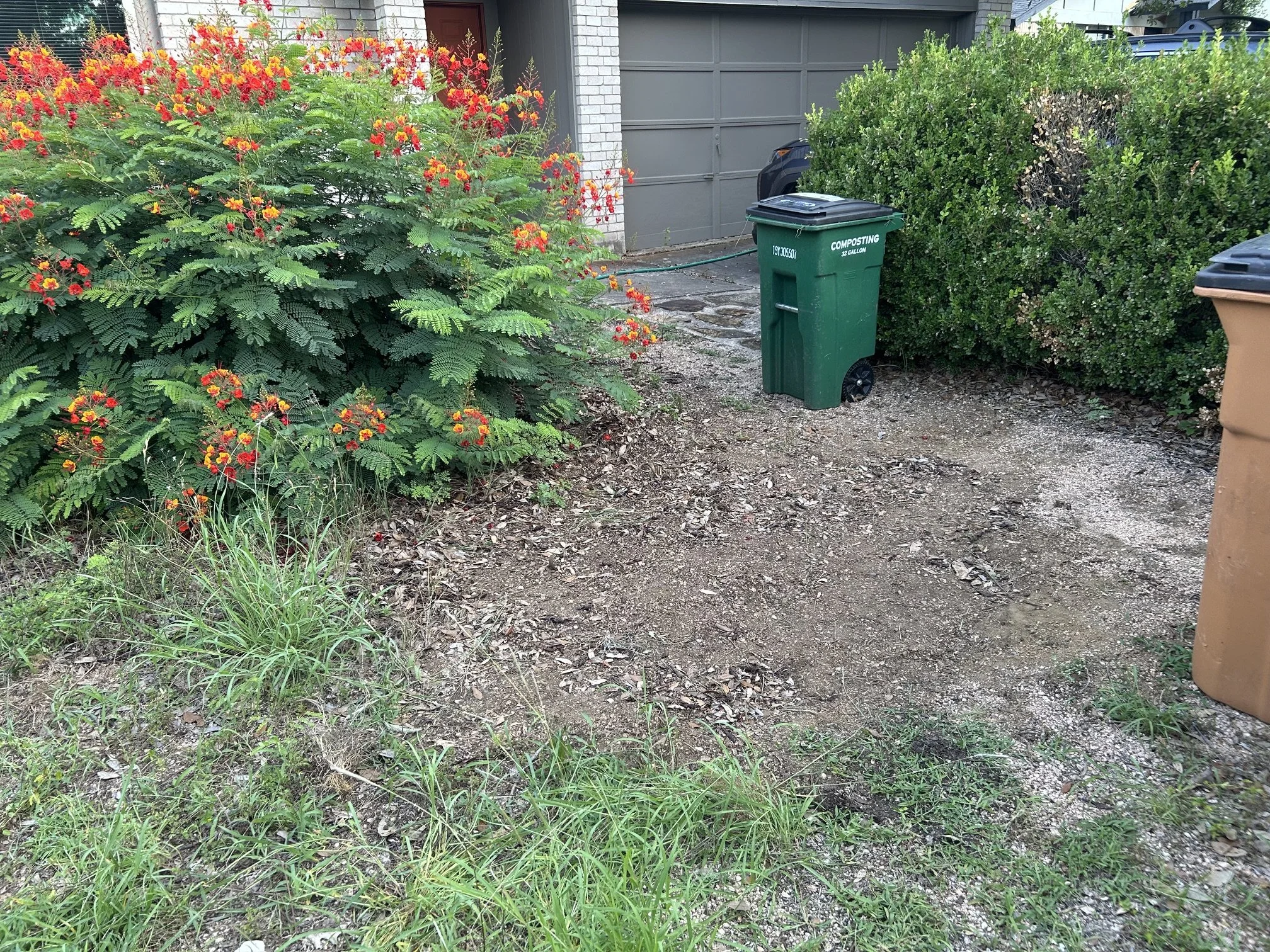 Image of a yard with a level, filled in hole