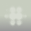 A close-up of a dotted circular light pattern on a green background.