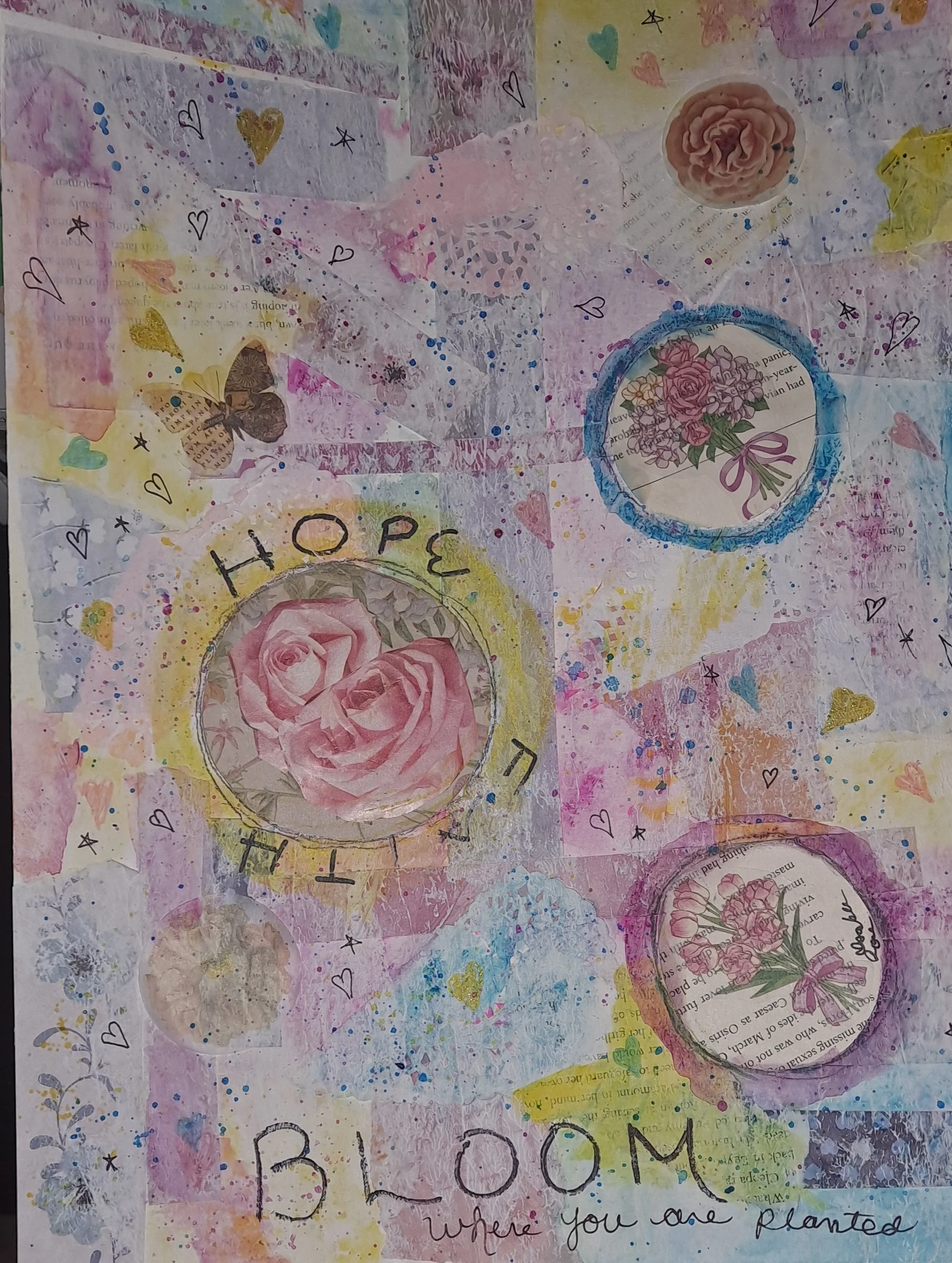A colorful collage with pink roses, hearts, stars, and handwritten words saying 'HOPE' and 'BLOOM'. It features cut-out images of roses, painted backgrounds, and various doodles, conveying a theme of hope and growth.