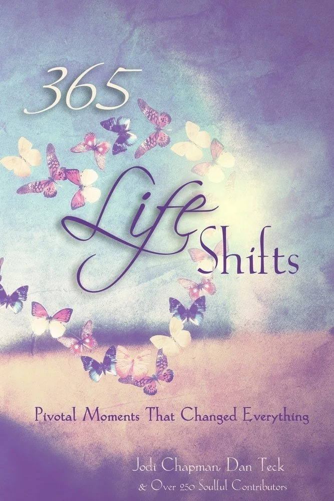 Book cover titled "365 Life Shifts" with butterflies in pastel colors and the subtitle "Pivotal Moments That Changed Everything" by Jodi Chapman, Dan Teck, and over 250 contributors.