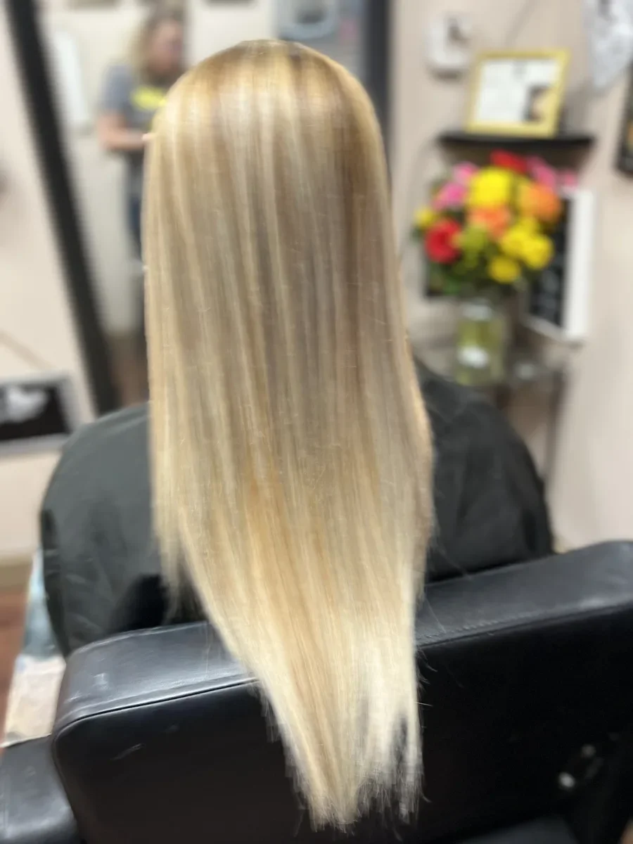 Long straight blonde ombre hair by The Hair Court in Bryan-College Station, TX.