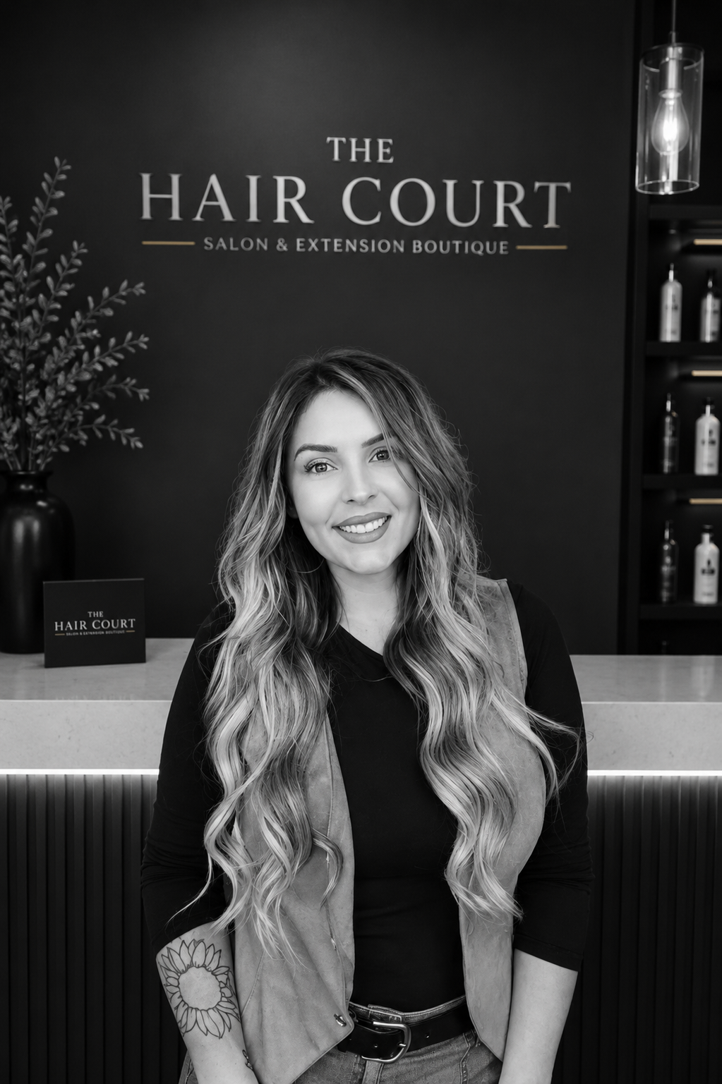 Courtney, senior hair extension and custom color specialist at The Hair Court Salon & Extension Boutique in Bryan, Texas
