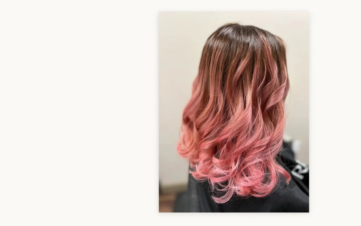 Pink fashion color wavy hair by The Hair Court in Bryan-College Station, TX.