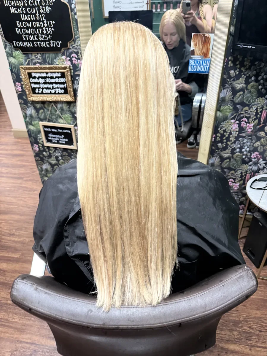 Long platinum blonde straight hair by The Hair Court in Bryan-College Station, TX.