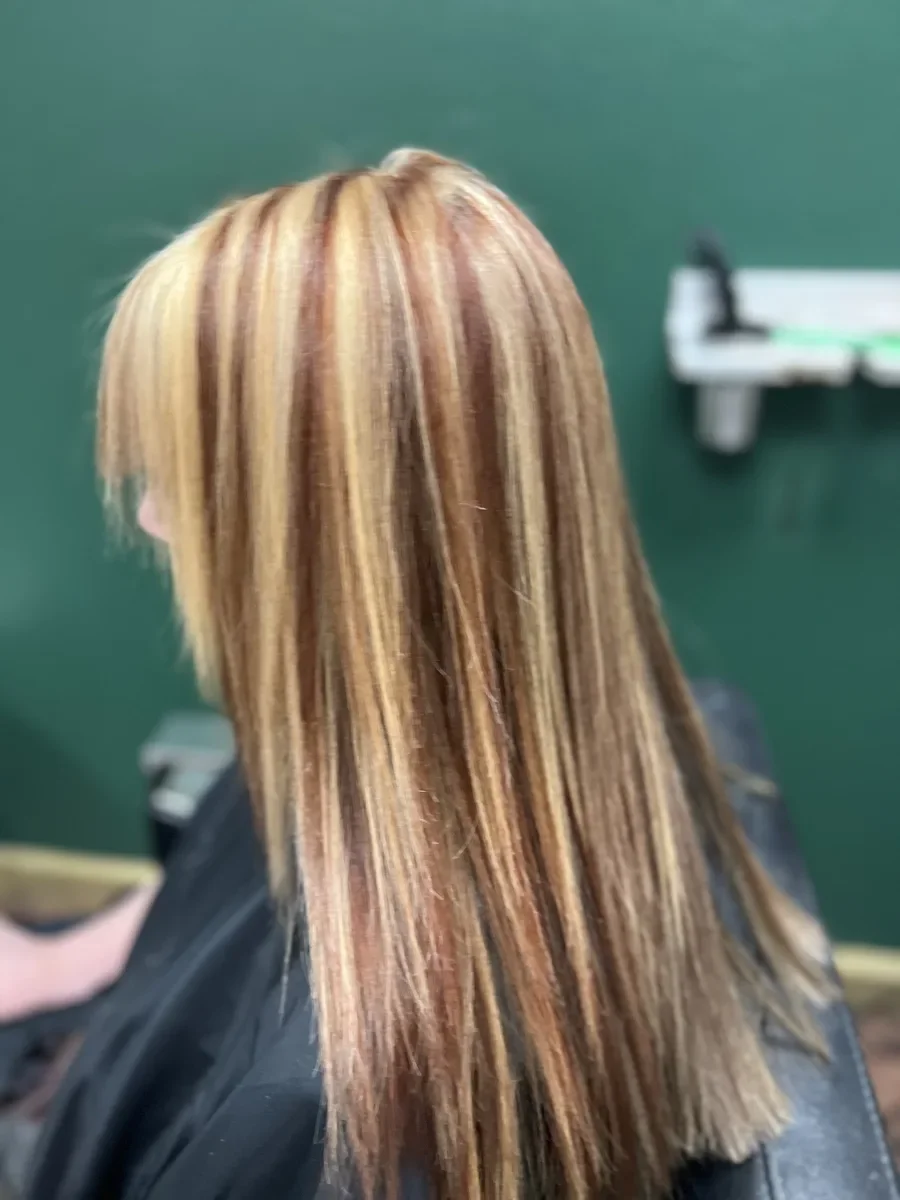 Blonde hair with rose accent by The Hair Court in Bryan-College Station, TX.