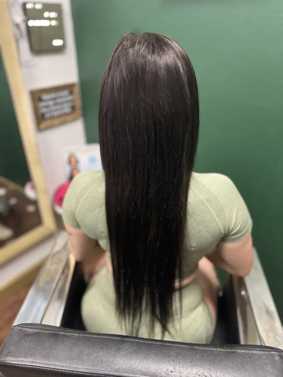 Long dark straight hair by The Hair Court in Bryan-College Station, TX.