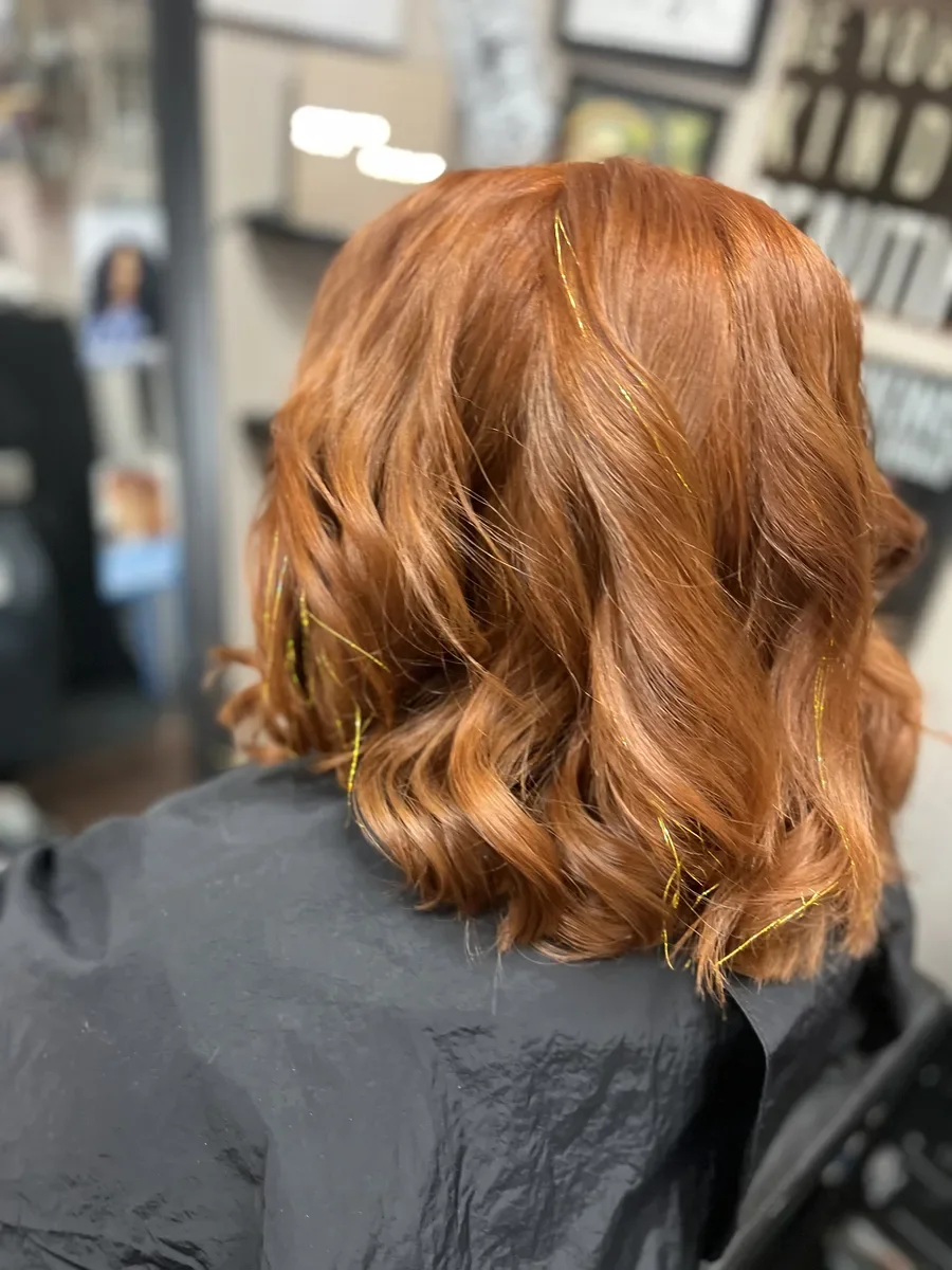 Copper wavy hair by The Hair Court in Bryan-College Station, TX.