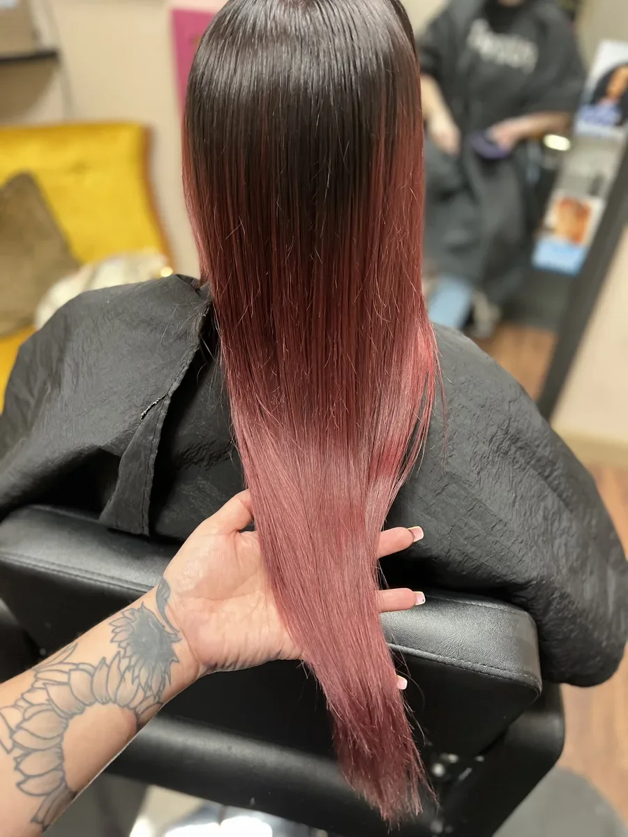 Long rose pink fashion color hair by The Hair Court in Bryan-College Station, TX.