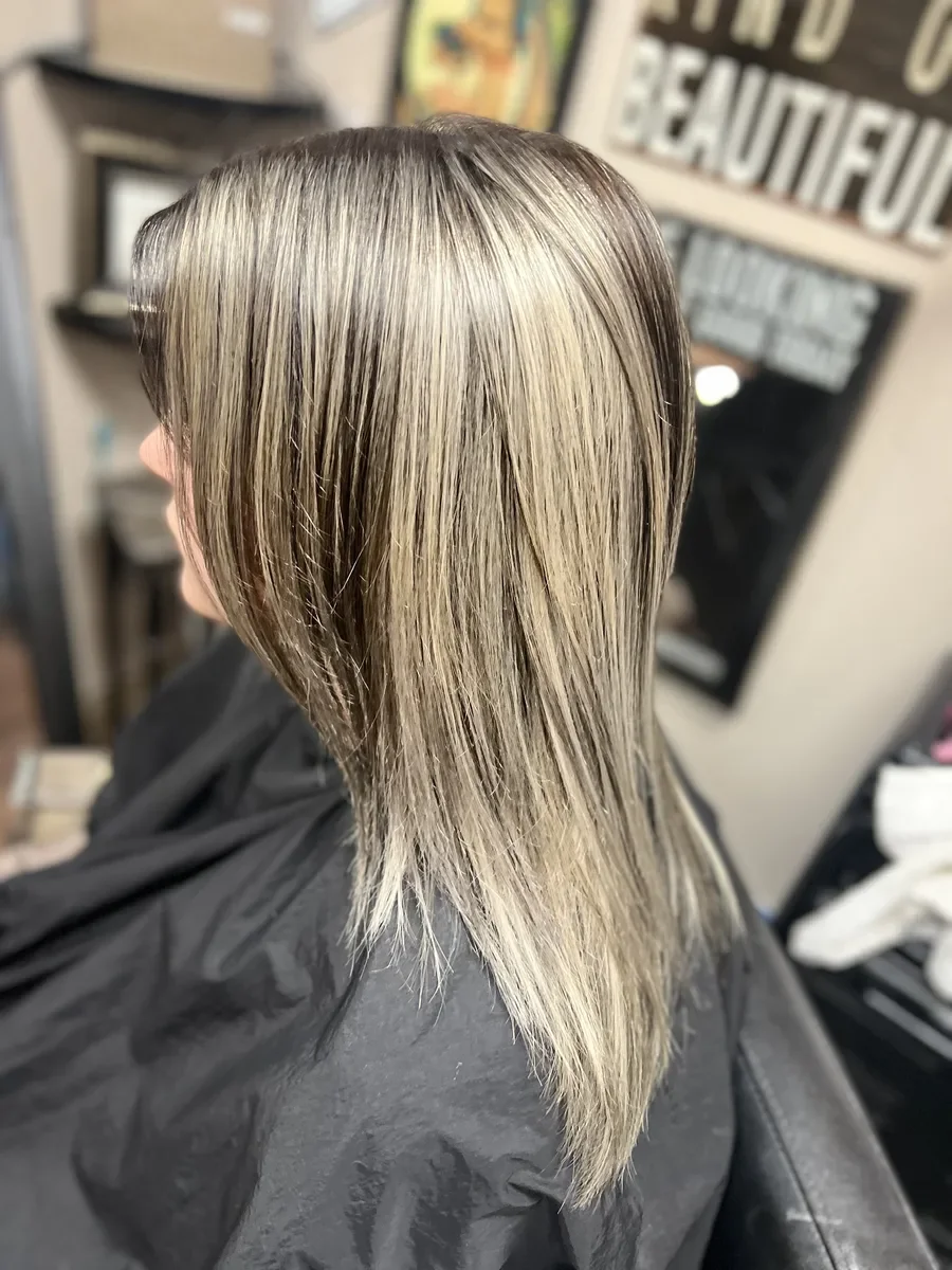 Dimensional blonde straight hair by The Hair Court in Bryan-College Station, TX.