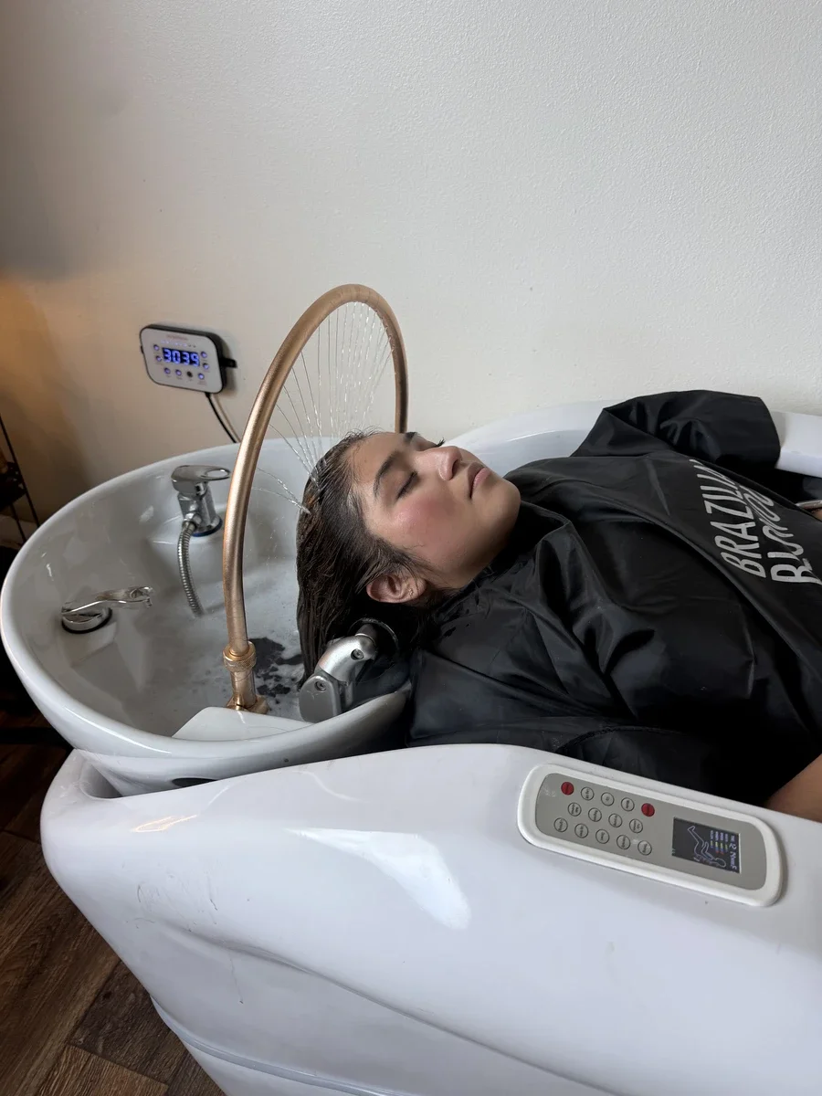 Head Spa scalp treatment with water halo and full-body massage at The Hair Court in Bryan-College Station, TX.