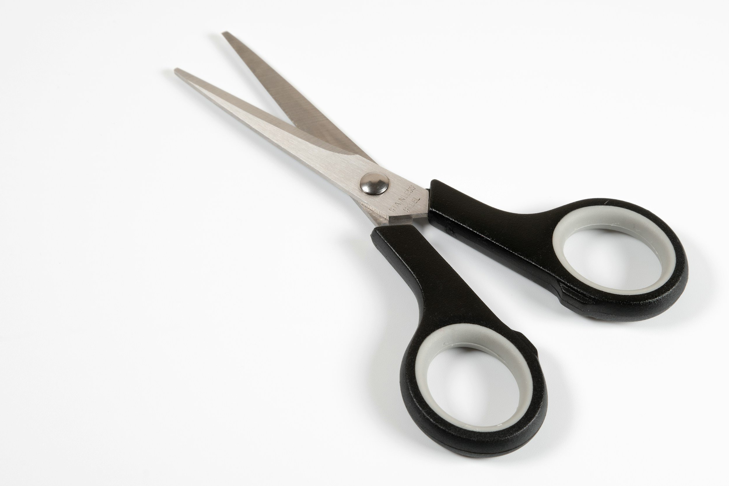 A pair of scissors - tool for trimming the pesky tags.