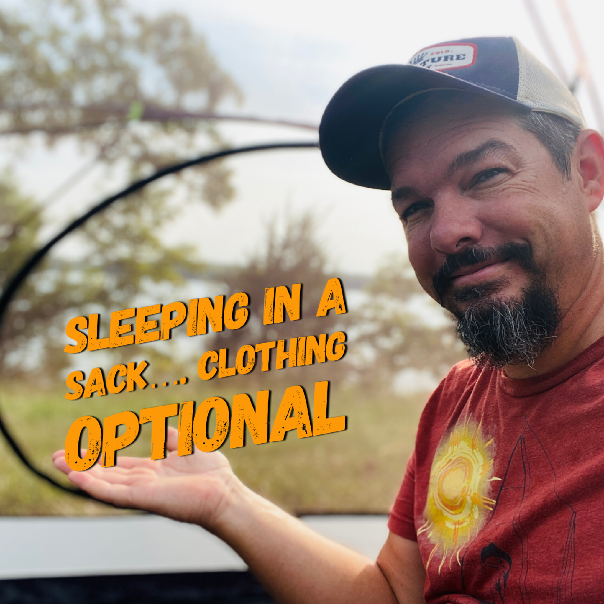 A man in a red shirt and blue and white hat smiles with his hand held up to text that reads, Sleeping in a Sack... Clothing Optional