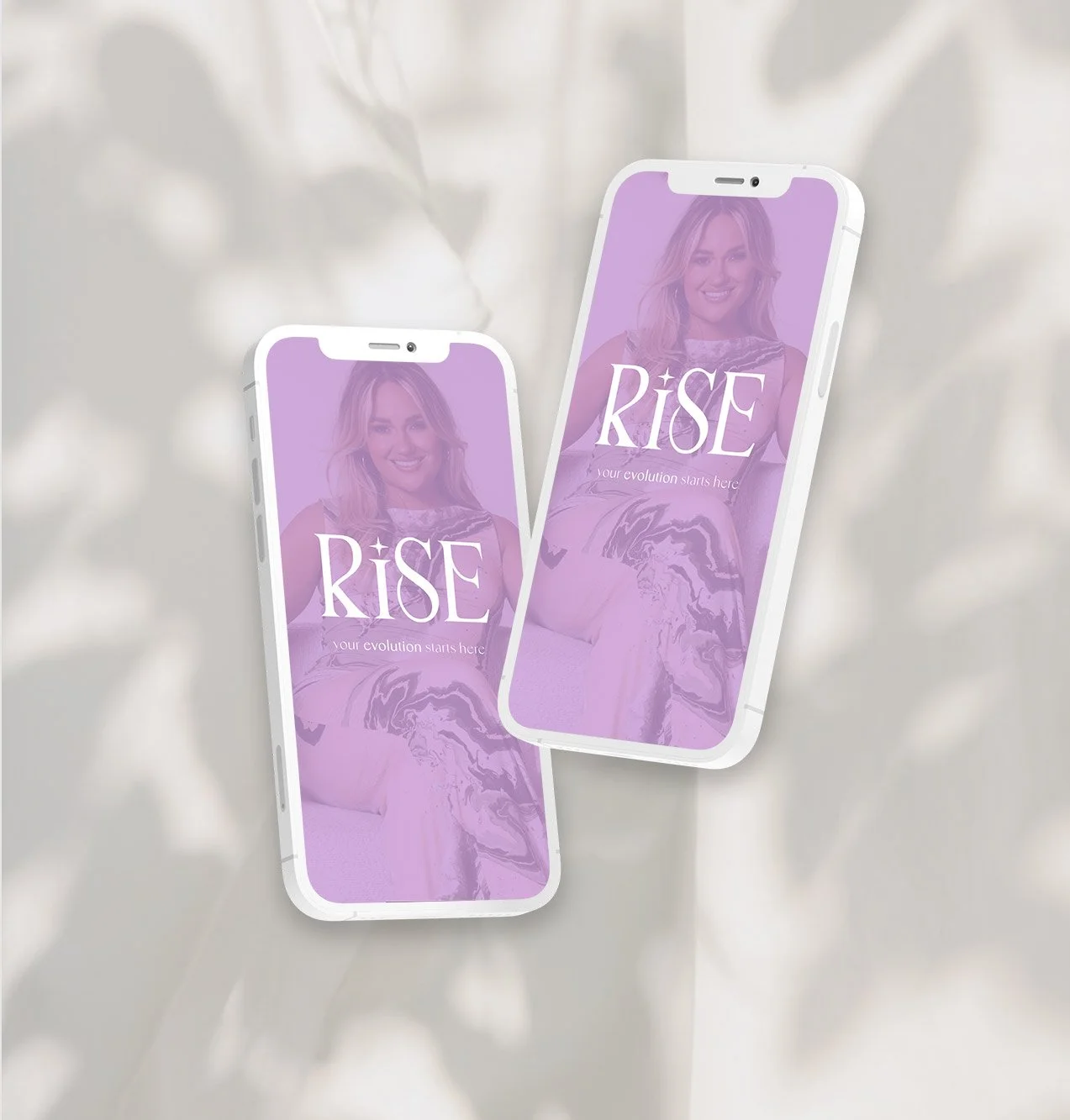 Two white smartphones displaying a purple-hued promotional image for 'RISE,' featuring a smiling woman with wavy blonde hair and the tagline 'your evolution starts here.'