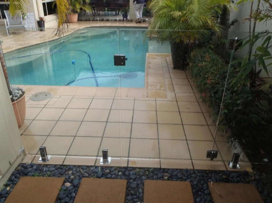Glass fence installed at swimming pool.