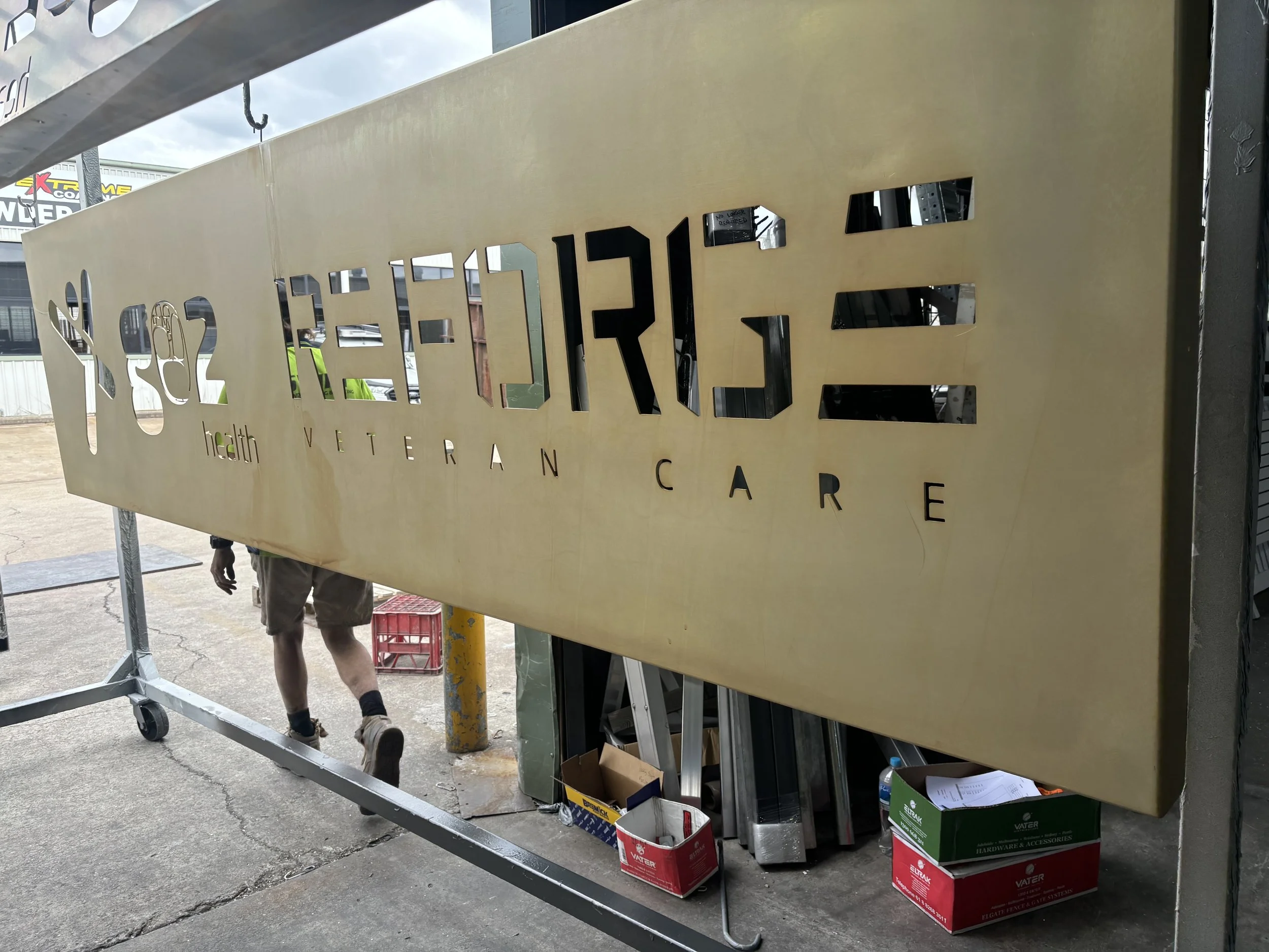 Sign manufacture and Powdercoating in workshop at Swift Powdercoating and Fencing Brisbane