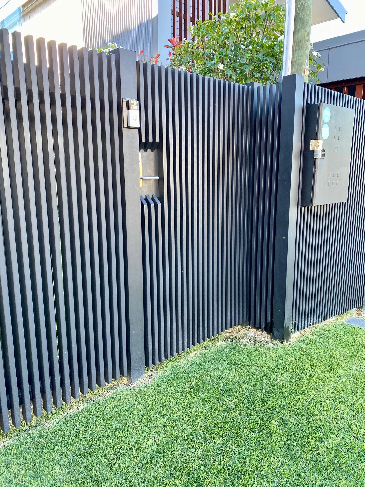 Black batten front gate - manufactured and installed by Swift Powdercoating & Fencing Brisbane