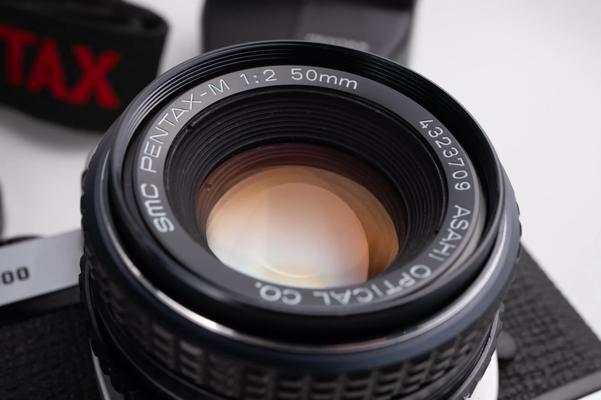 Pentax K1000 35mm film camera, lens glass view