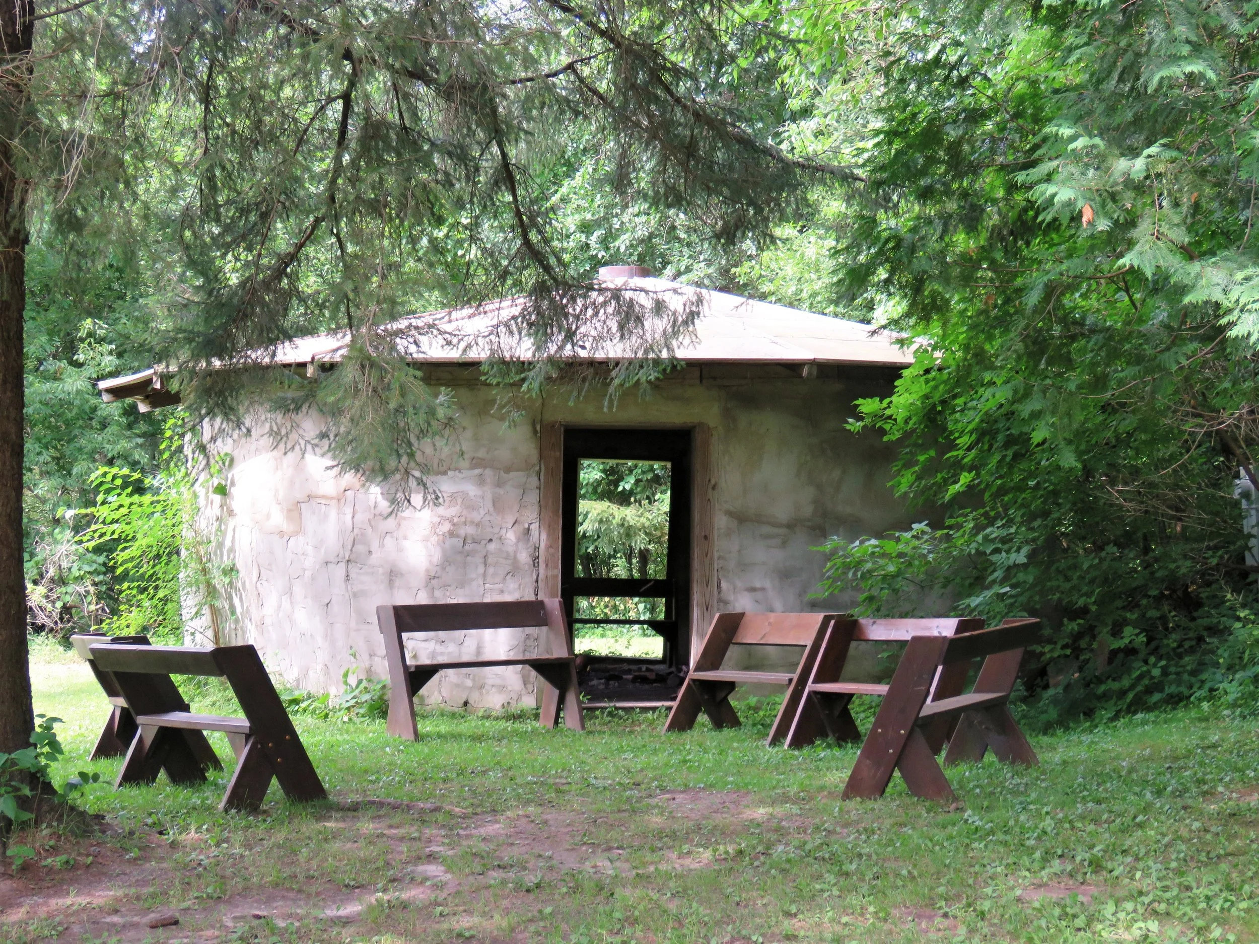 Straw Bale Hut outside w benches.jpg