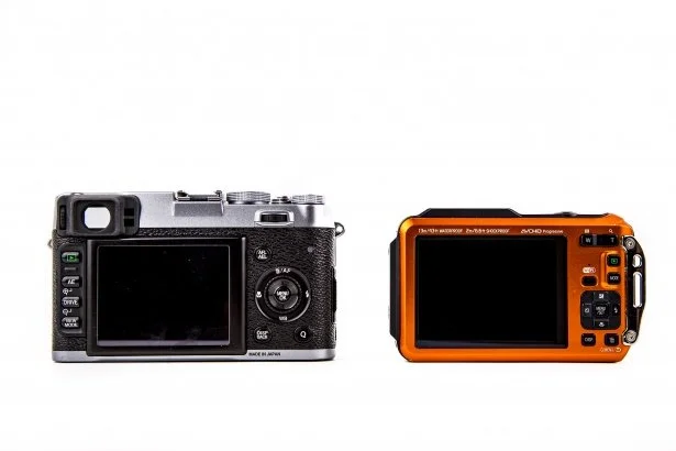 Two digital cameras placed side by side against a white background.