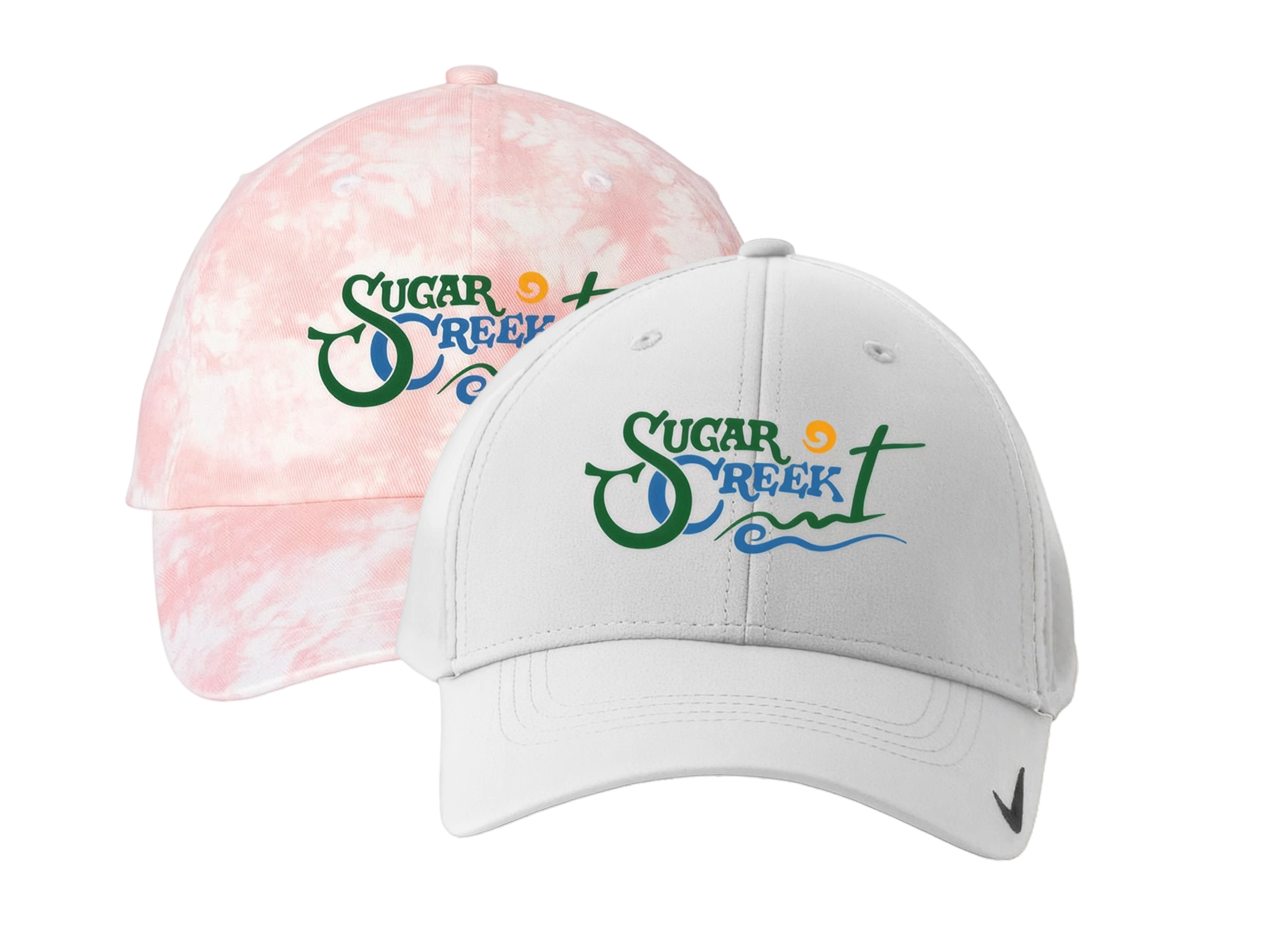 Two caps, one pink with tie-dye pattern and one white, both with 'Sugar Creek' logo on the front.