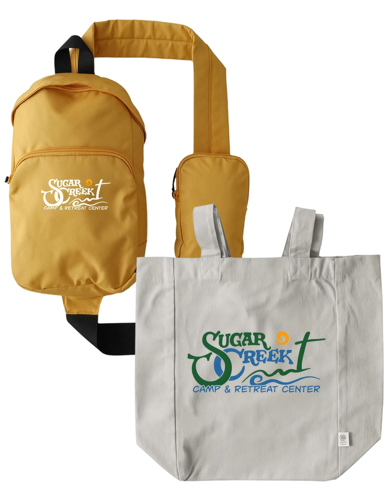 Yellow backpack with 'Sugar Creek Camp & Retreat Center' logo, small yellow pouch, and white reusable shopping bag with matching logo.