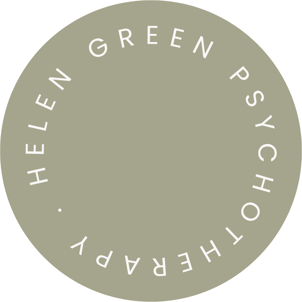 A circular logo with a beige background and white text that says "THE REAL PAGE. GREEN PSYCHOTHERAPY" arranged in a circle.