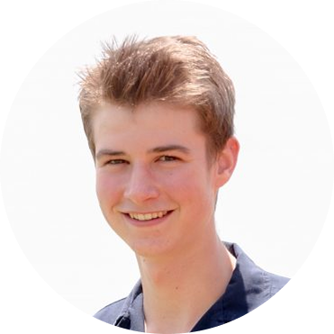 A young man with light brown hair smiling at the camera