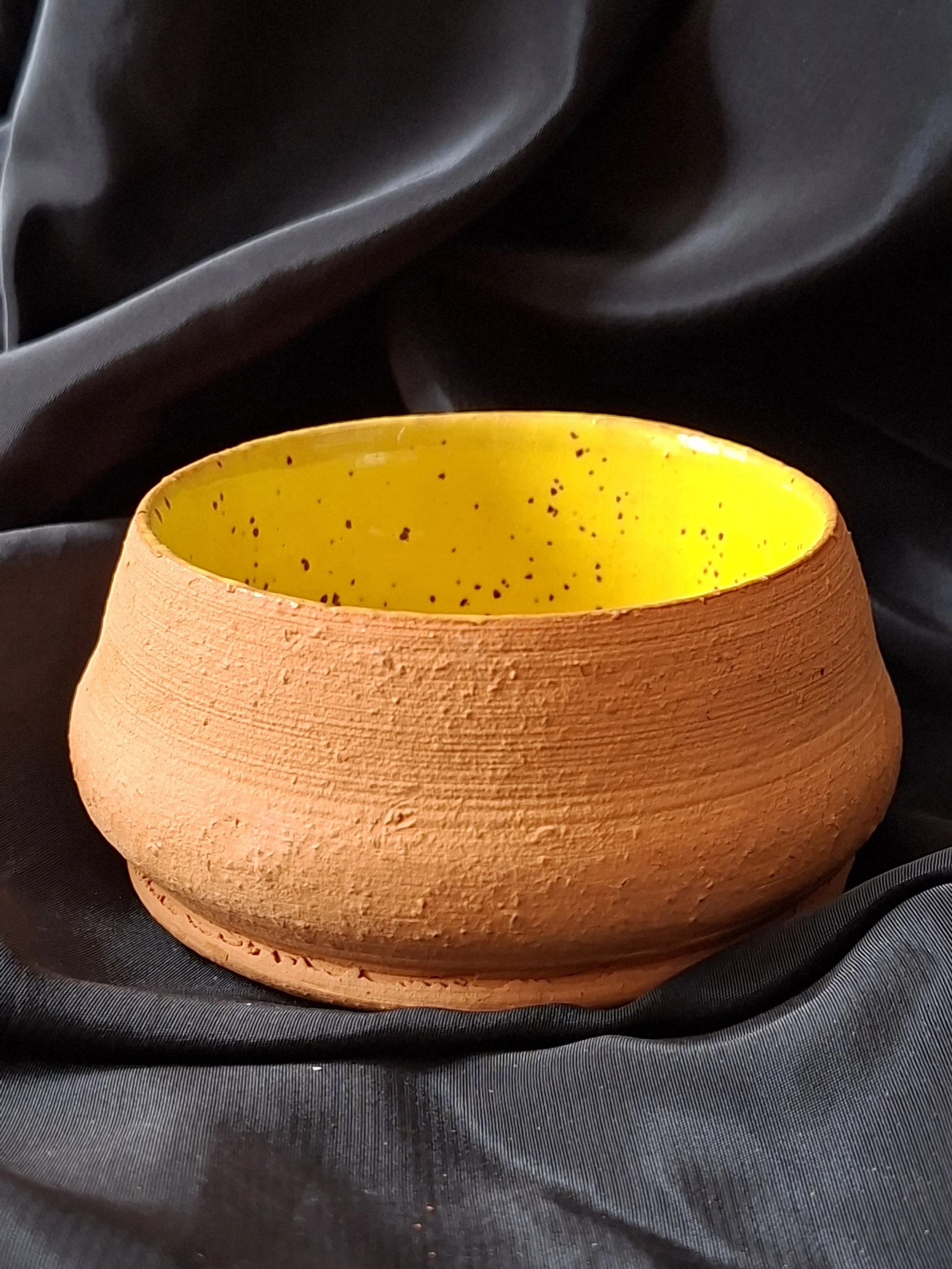 Yellow earthenware bowl
