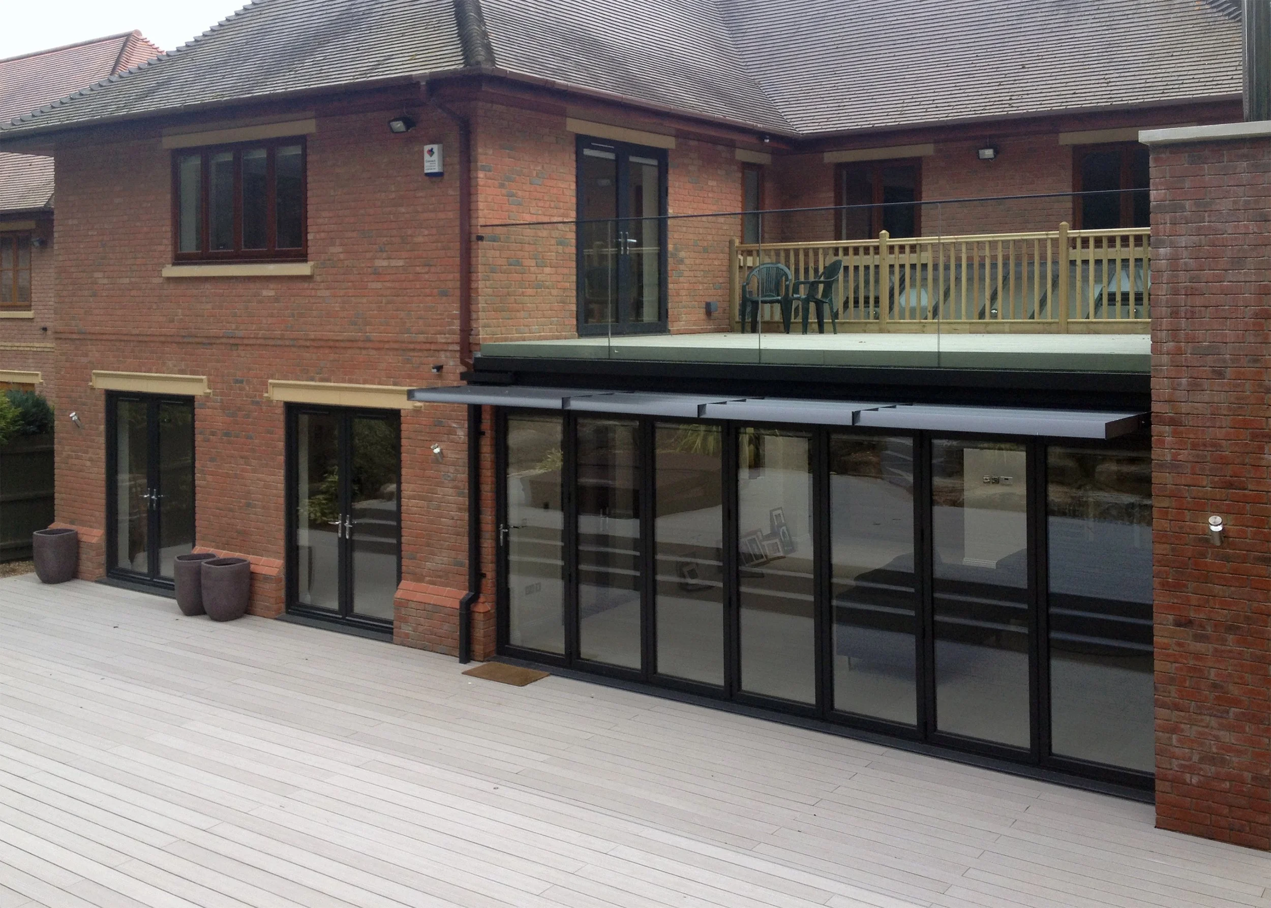 Smart Aluminium Bi-folding Doors with Brise Soleil Shading