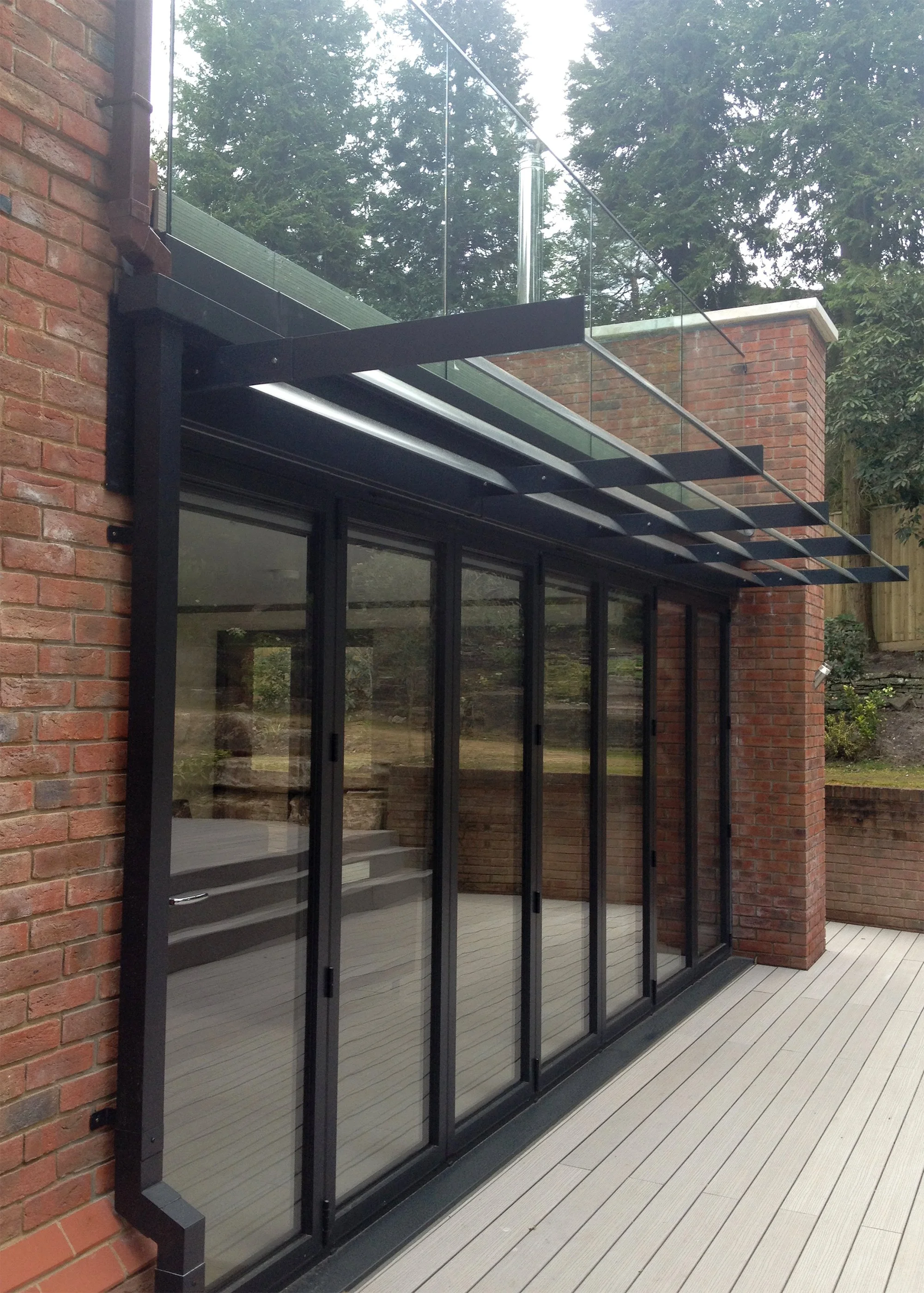 Smart Aluminium Bi-folding Doors with Brise Soleil Shading