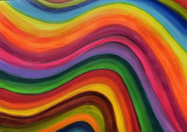 Colour Without Rules, an original abstract painting by Nathaly Ellen Celia, featuring layered waves of vivid pink, orange, yellow, green, blue and purple, bringing contrasting colours together in a flowing composition.