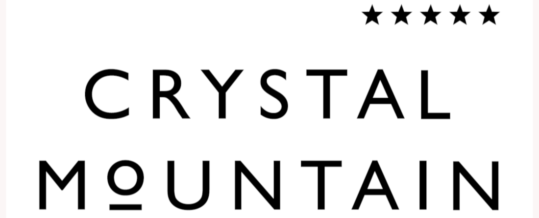 Text reads "CRYSTAL MOUNTAIN" with five stars above the text.