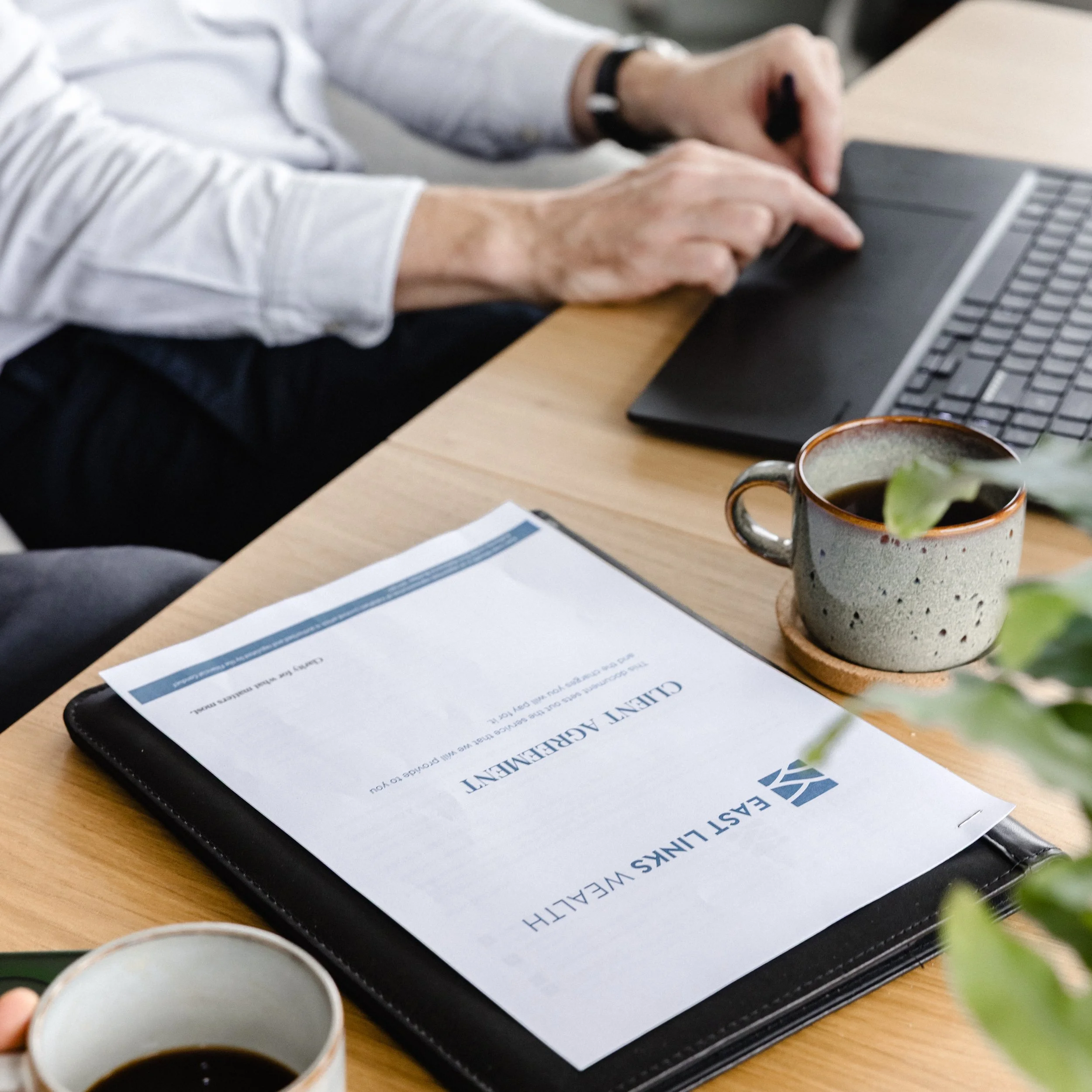 Financial planning documents and laptop, East Links Wealth, Fife