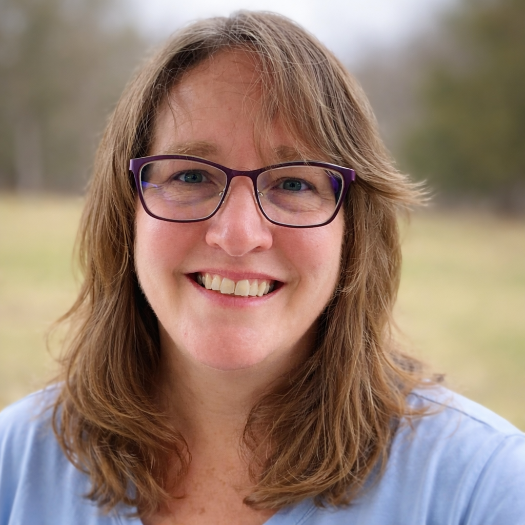 Holly Markley, LPC smiling outdoors.