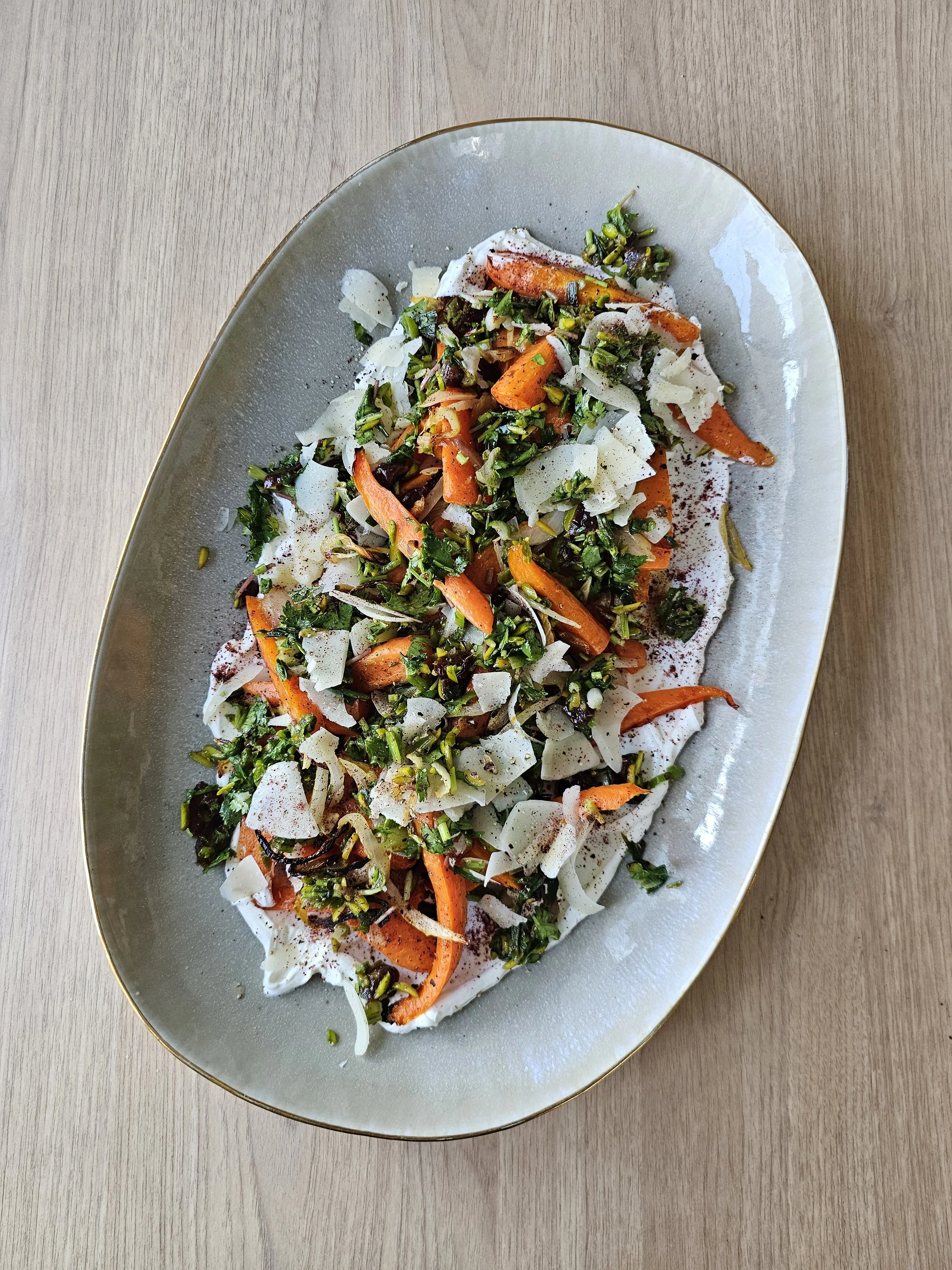 Roast carrots with labne, herbs, pistachio + date salsa