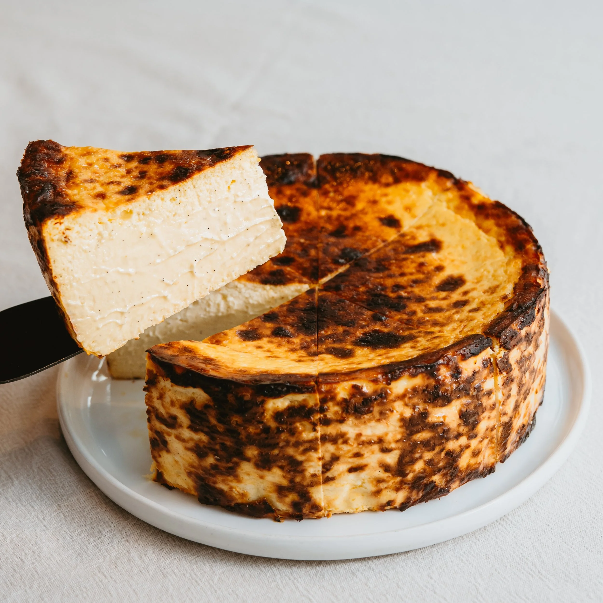 Yuzu &amp; vanilla basque style cheesecake 💛 

This is our best seller after the classic, it's fresh, citrusy, and always creamy 

Available everyday in our shop and on our website

#yuzu #vanilla #basque #cheesecake #creamy