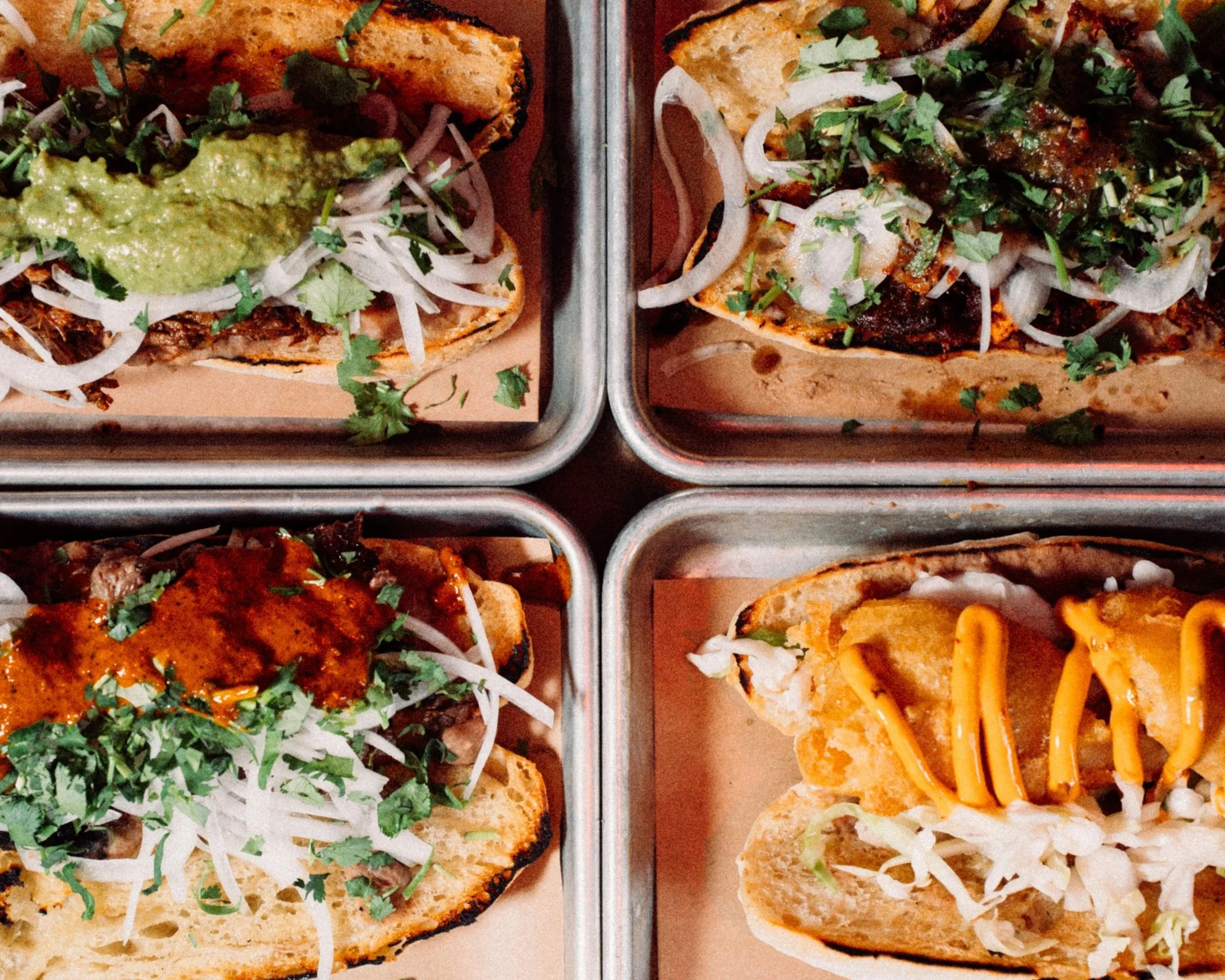 Lamb barbacoa and al pastor tortas