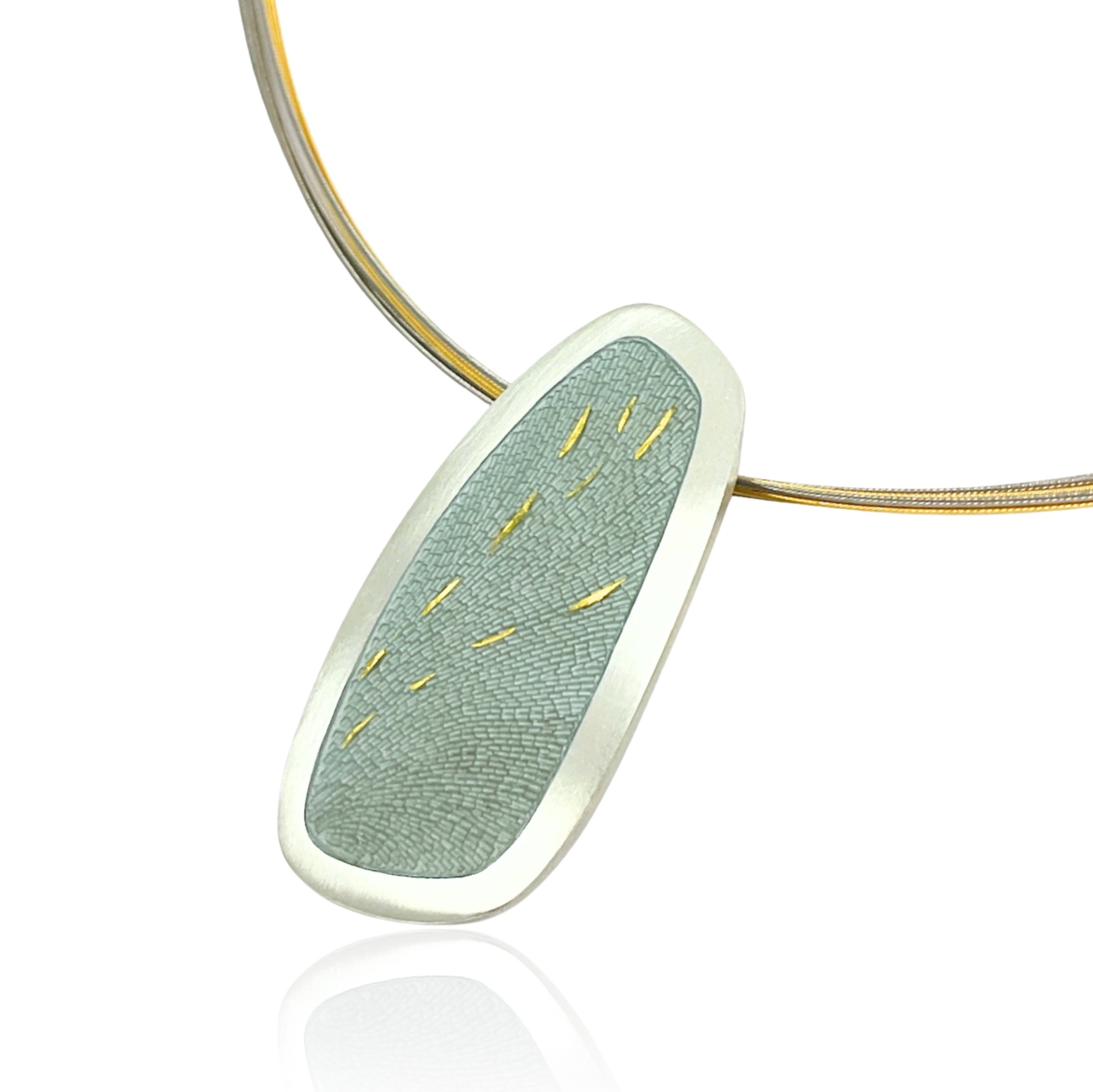 Grey enamel pendant on a gold chain
