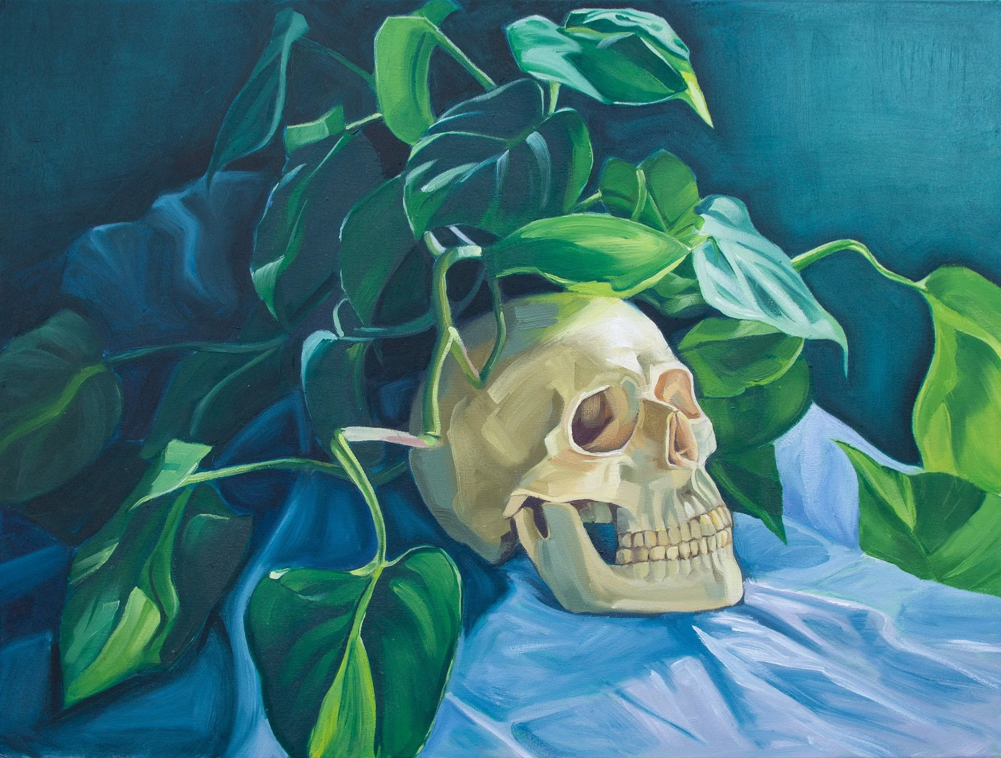 Painting of a human skull surrounded by green leaves against a blue background.