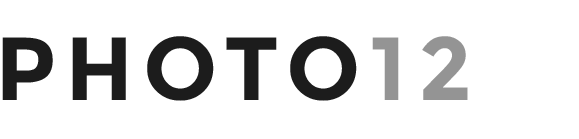 Logo avec le texte 'PHOTO12' en noir, gris et blanc.