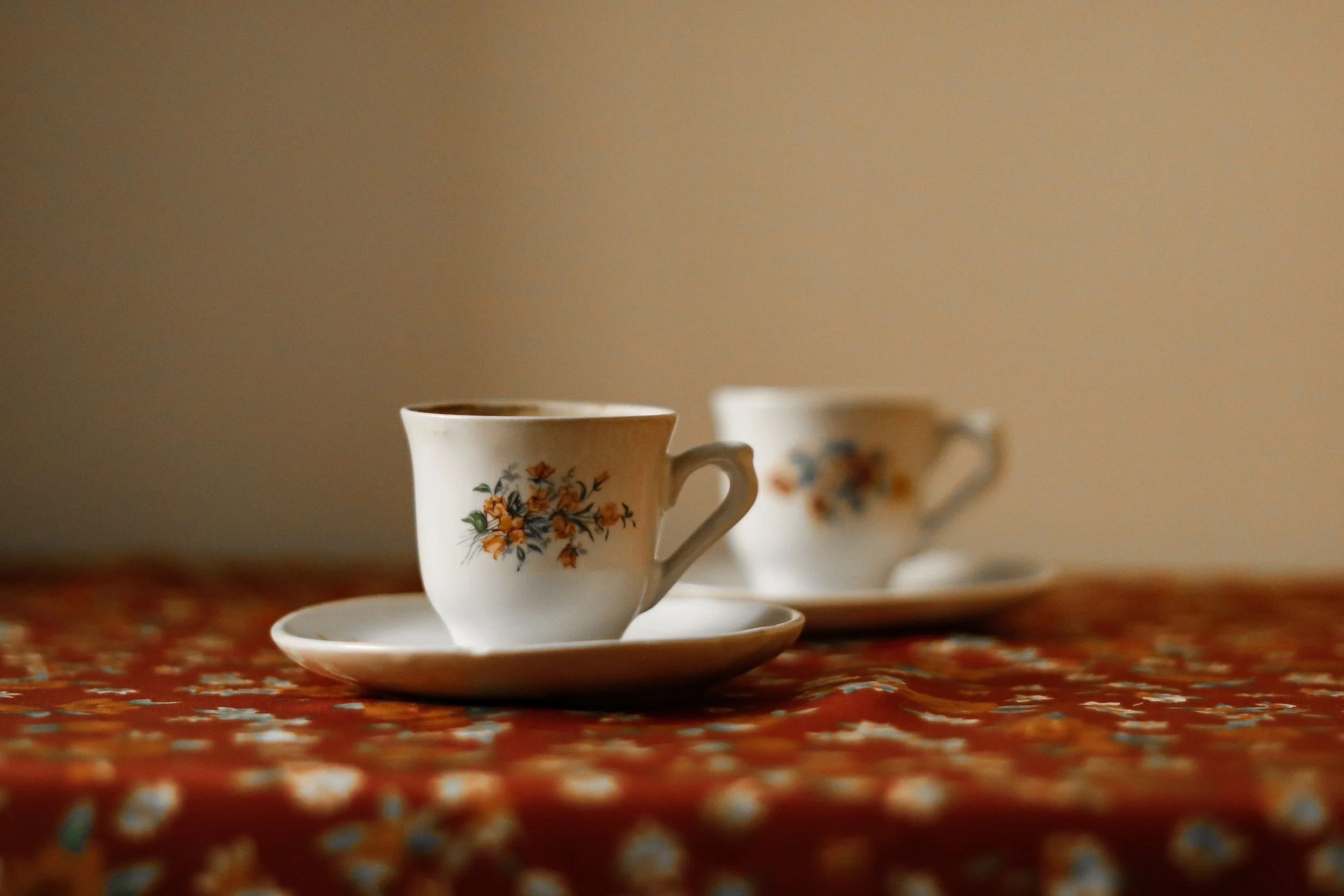 Two coffee cups on a kitchen counter, one untouched, showing emotional distance in a military marriage.