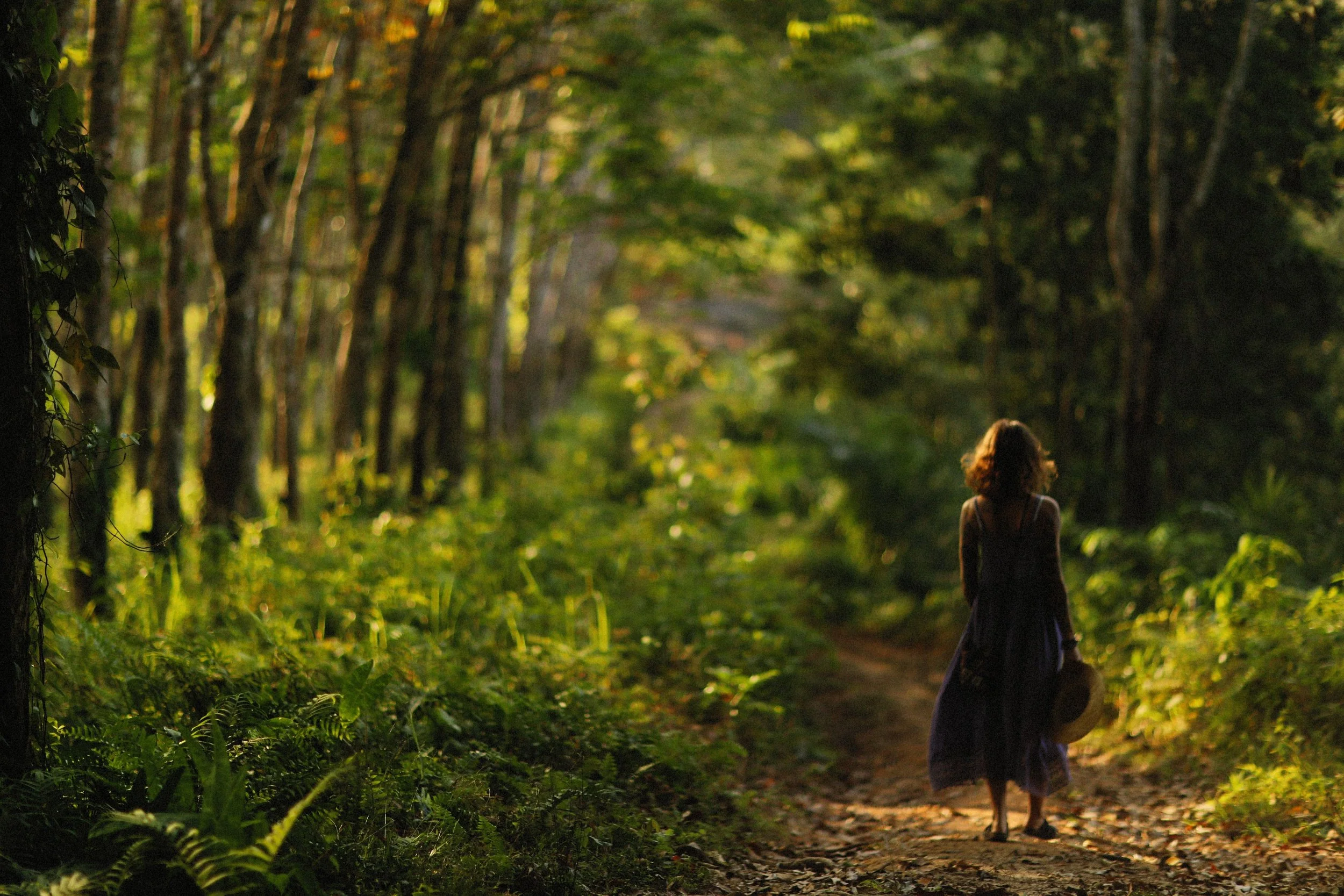 Woman walking alone outdoors in Colorado Springs, taking time for her own care.