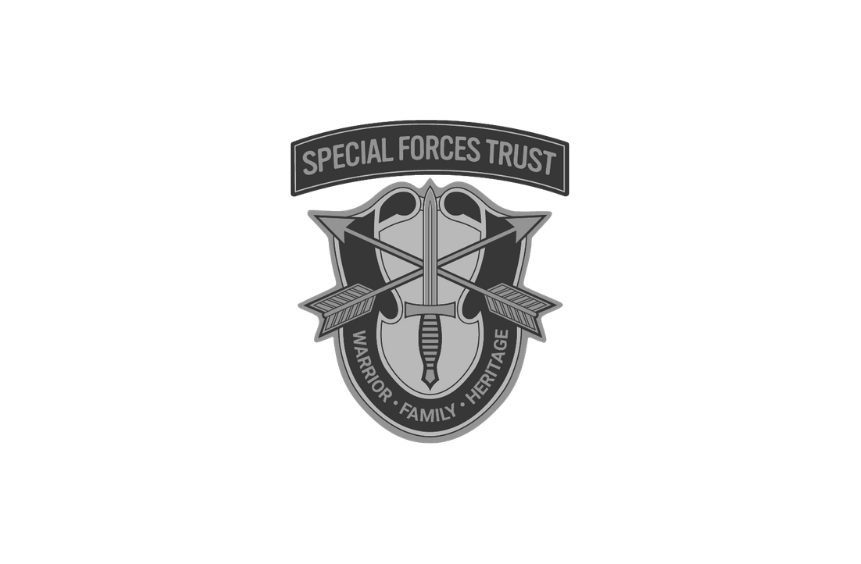 The emblem of the Special Forces Trust featuring a sword and two arrows, with the words 'Special Forces Trust' at the top and 'Warrior, Family, Heritage' at the bottom.