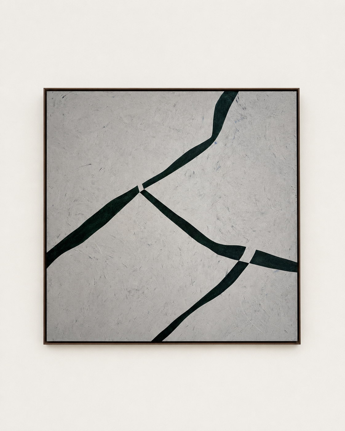 Muga by Guillermo Capella, a contemporary abstract painting presented in a slim dark wood frame, with deep green-black forms over a textured mineral grey ground.