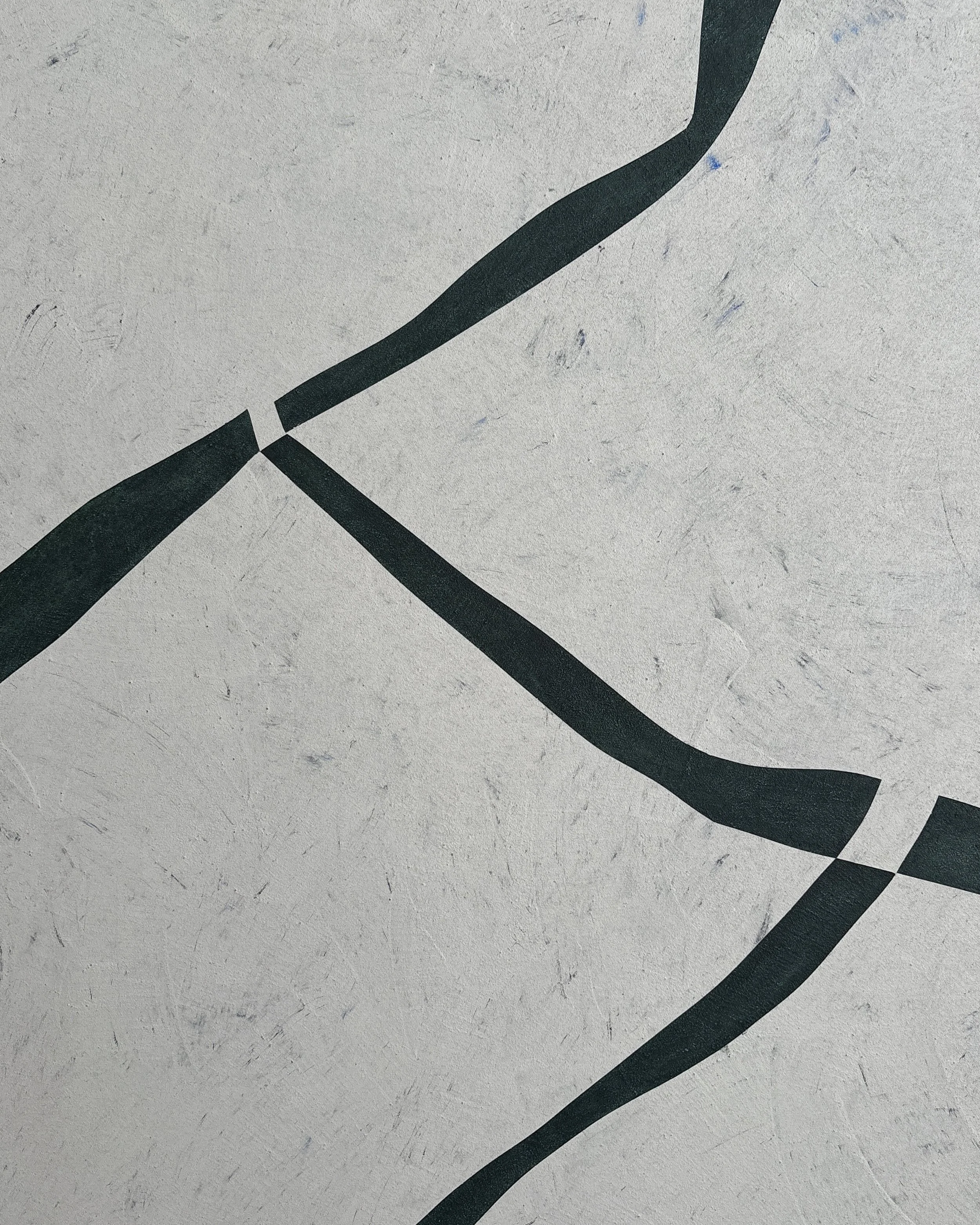 Detail view of Muga, an abstract painting by Guillermo Capella, showing flowing dark geometric forms, negative space and a tactile grey surface.