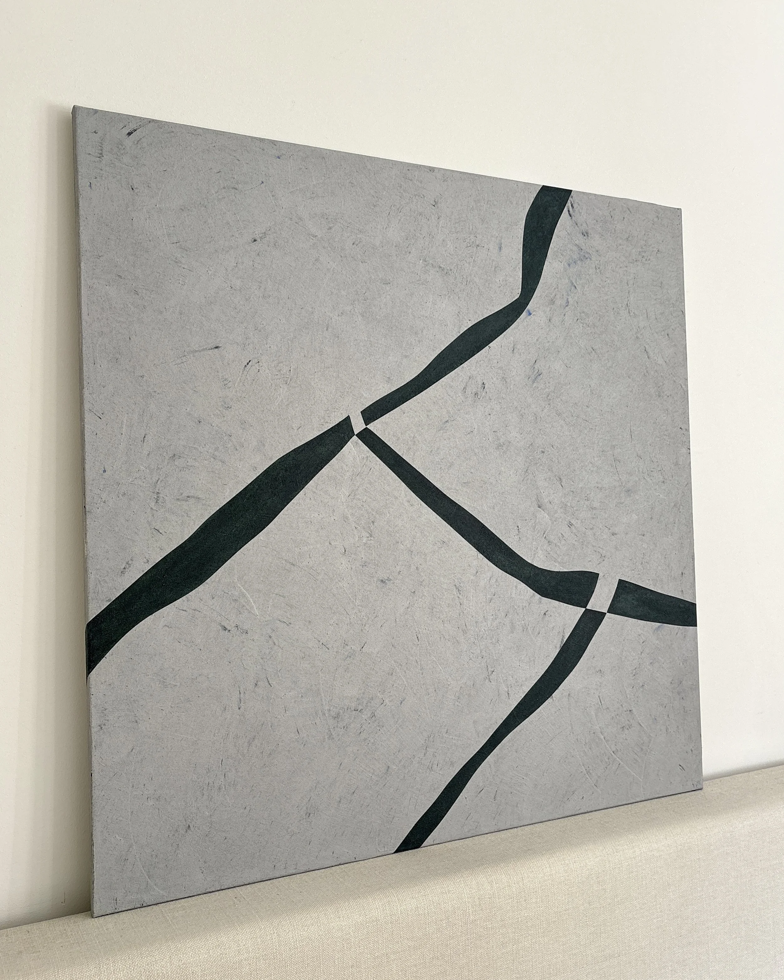 Angled view of Muga by Guillermo Capella, showing the full abstract composition, textured mineral surface and slim profile of the original canvas.